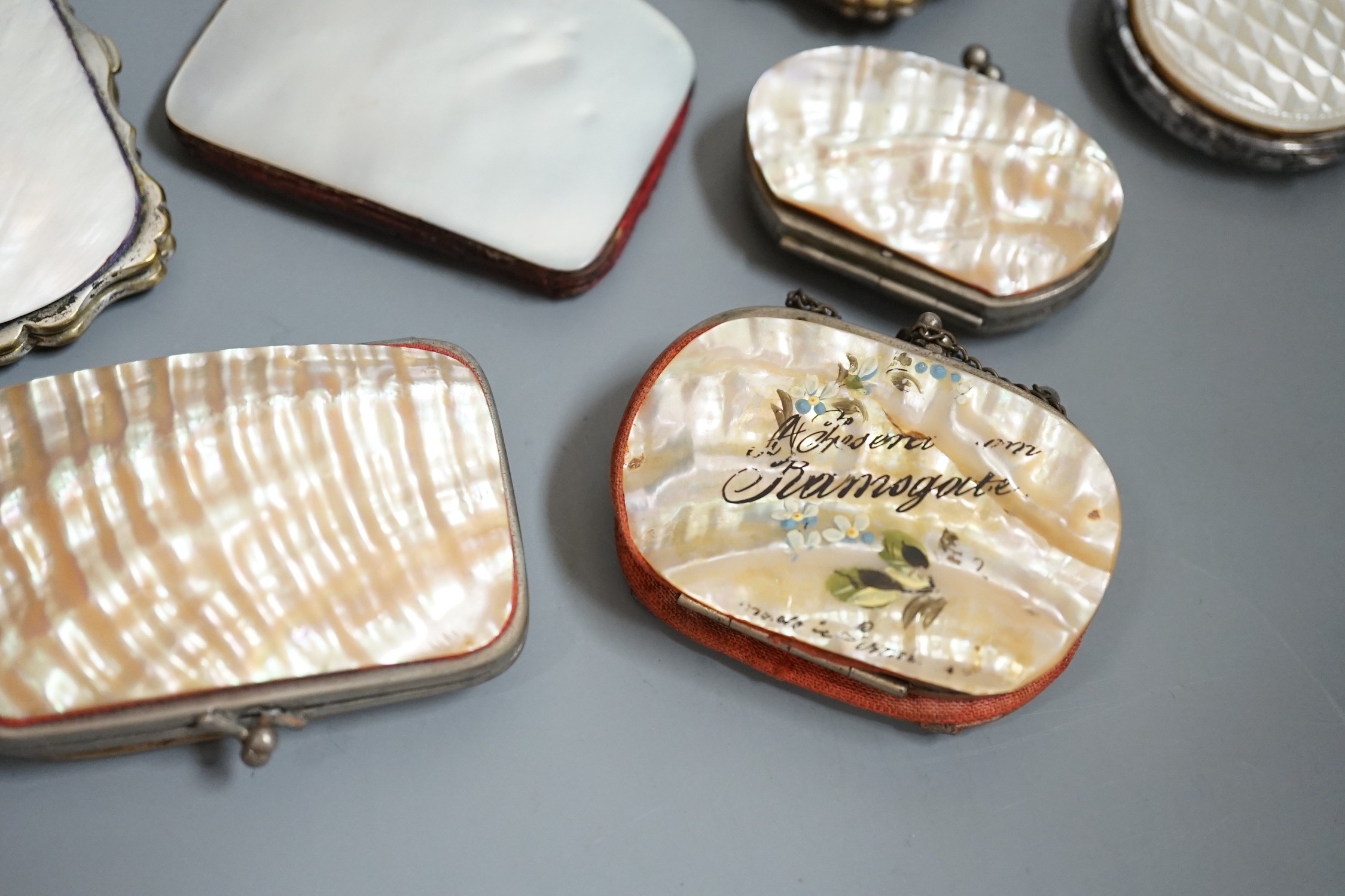 Twelve 19th century mother of pearl purses and containers